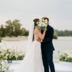 wedding ceremony of the newlyweds on the pier near the restaurant